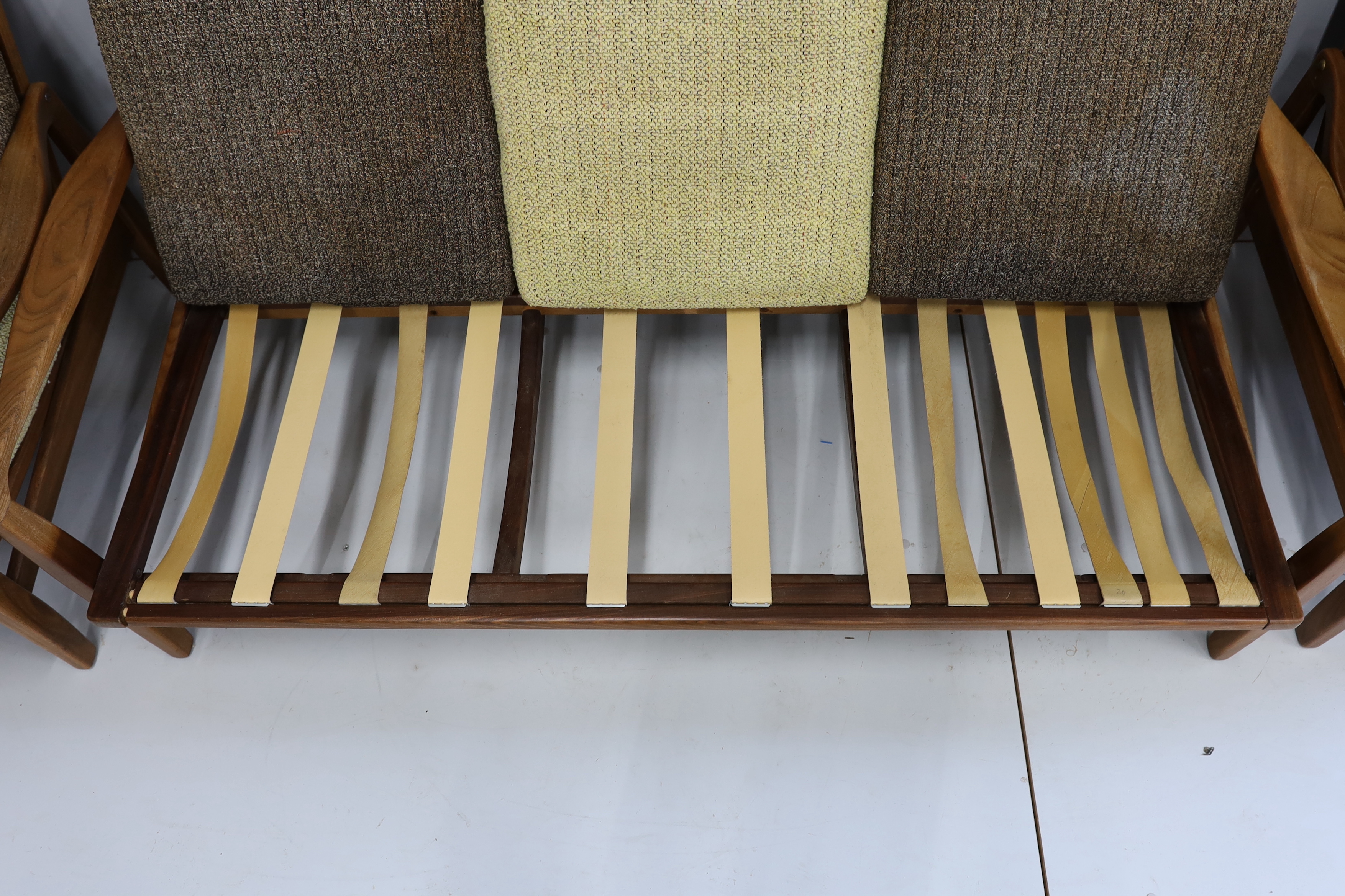 In the manner of Zenon Baczyk, a mid century teak three piece lounge suite, settee length 168cm, depth 88cm, height 68cm